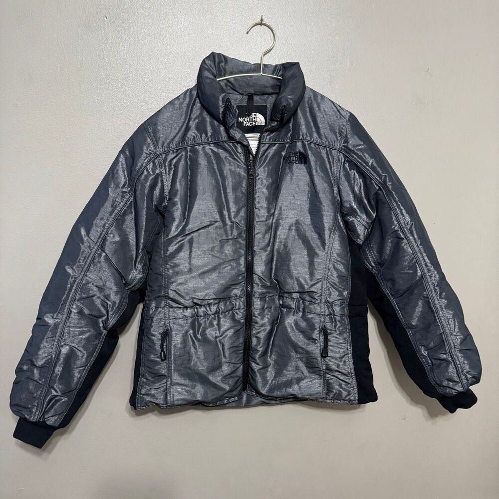 The North Face 600-fill down puffer jacket featuring a shiny gray finish size la
